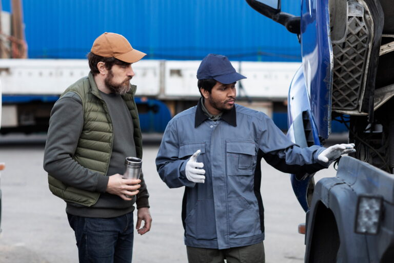 side-view-men-looking-inside-truck-1-768x512.jpg